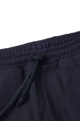 Cotton-piqué tracksuit bottoms with logo detail