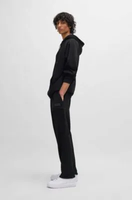 Cotton-terry tracksuit bottoms with decorative reflective trims