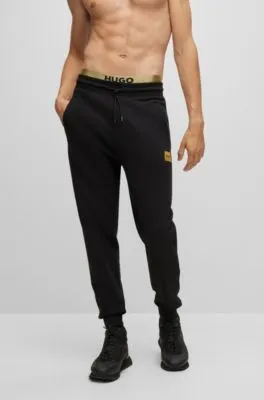 Cotton-terry tracksuit bottoms with foil-print logo