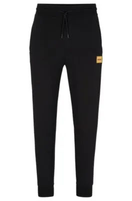 Cotton-terry tracksuit bottoms with foil-print logo