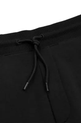 Cotton-terry tracksuit bottoms with foil-print logo