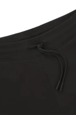 Cotton-terry tracksuit bottoms with Happy HUGO logo patch