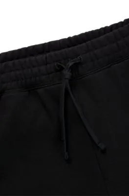 Cotton-terry tracksuit bottoms with puffed flame logo