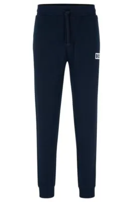 Cuffed tracksuit bottoms in French terry with logo print