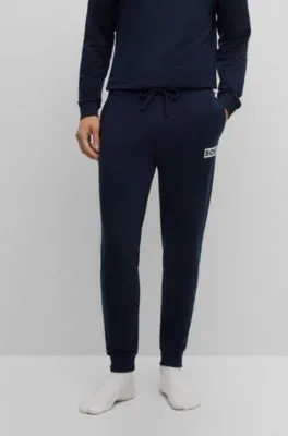 Cuffed tracksuit bottoms in French terry with logo print