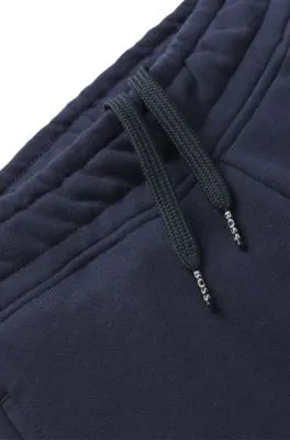 Kids' tracksuit bottoms with logo print