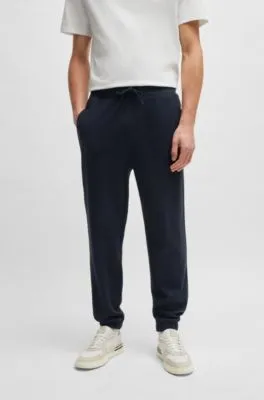 Regular-fit tracksuit bottoms in performance fabric