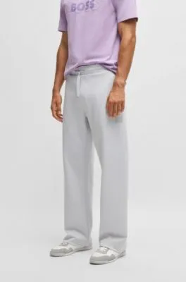 Tracksuit bottoms in a drop-needle cotton